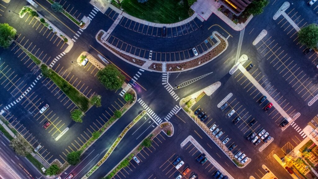 a freshly paved and striped parking lot from above